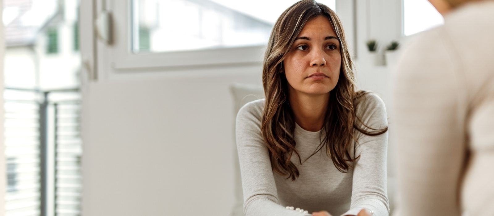 woman phone calm warm interior soft natural light