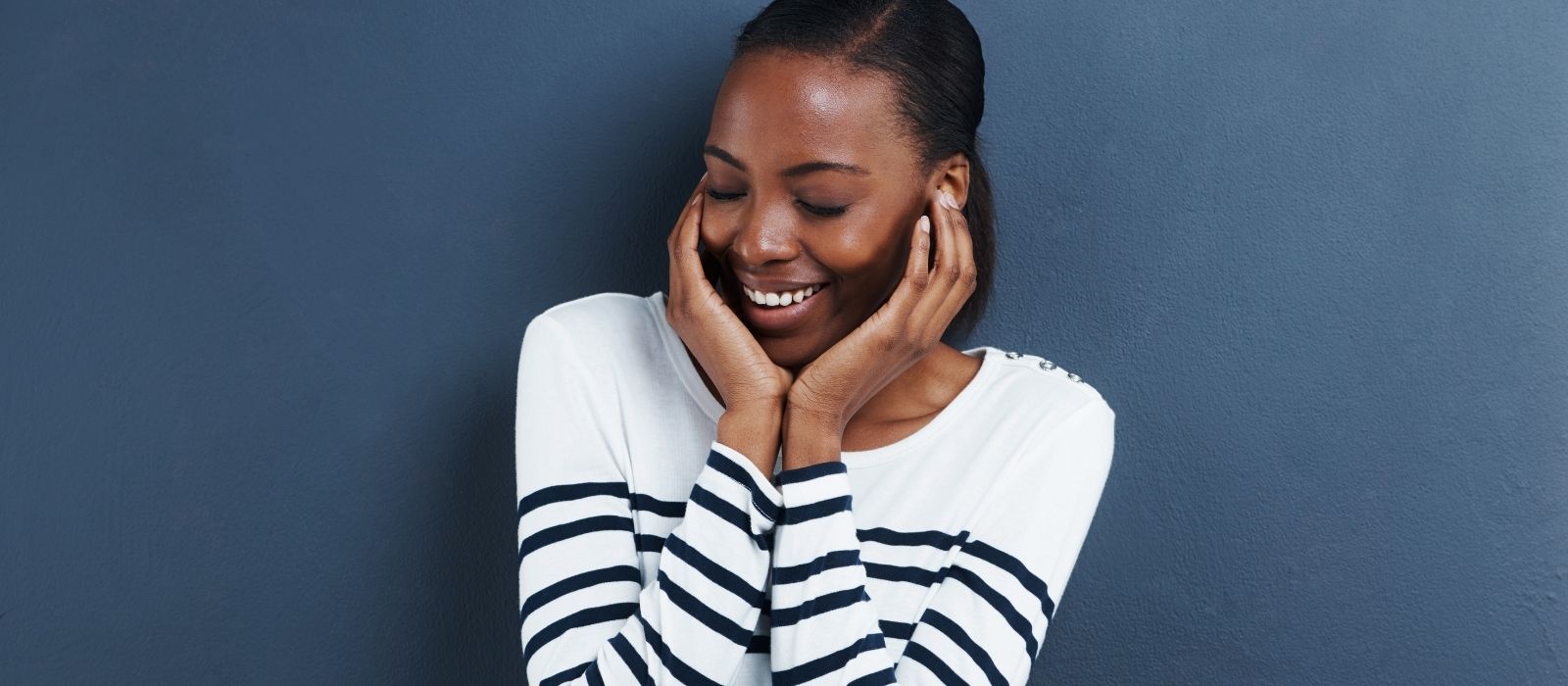 woman warm smile calm natural light interior