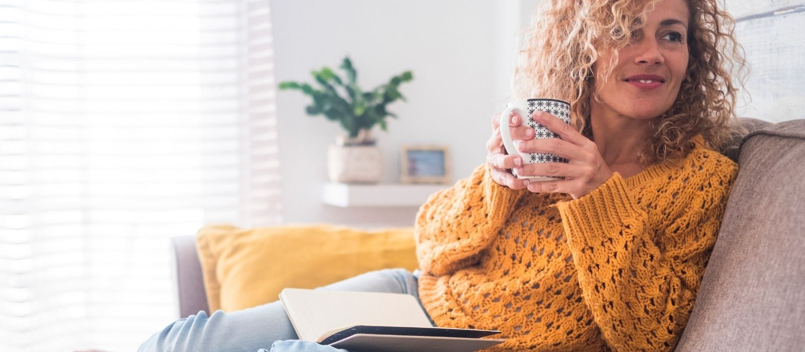woman journaling warm natural light calm interior