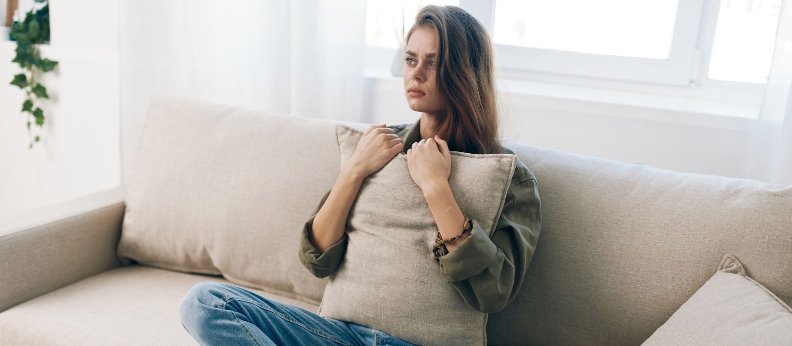 woman quiet reflection warm soft light interior