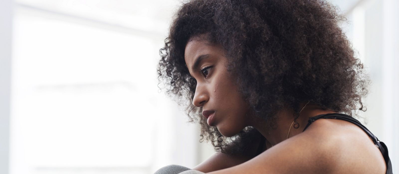 woman calm self assured warm natural light interior